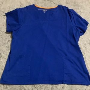 Blue women’s scrub shirt, size XL the brand is ScrubStar.